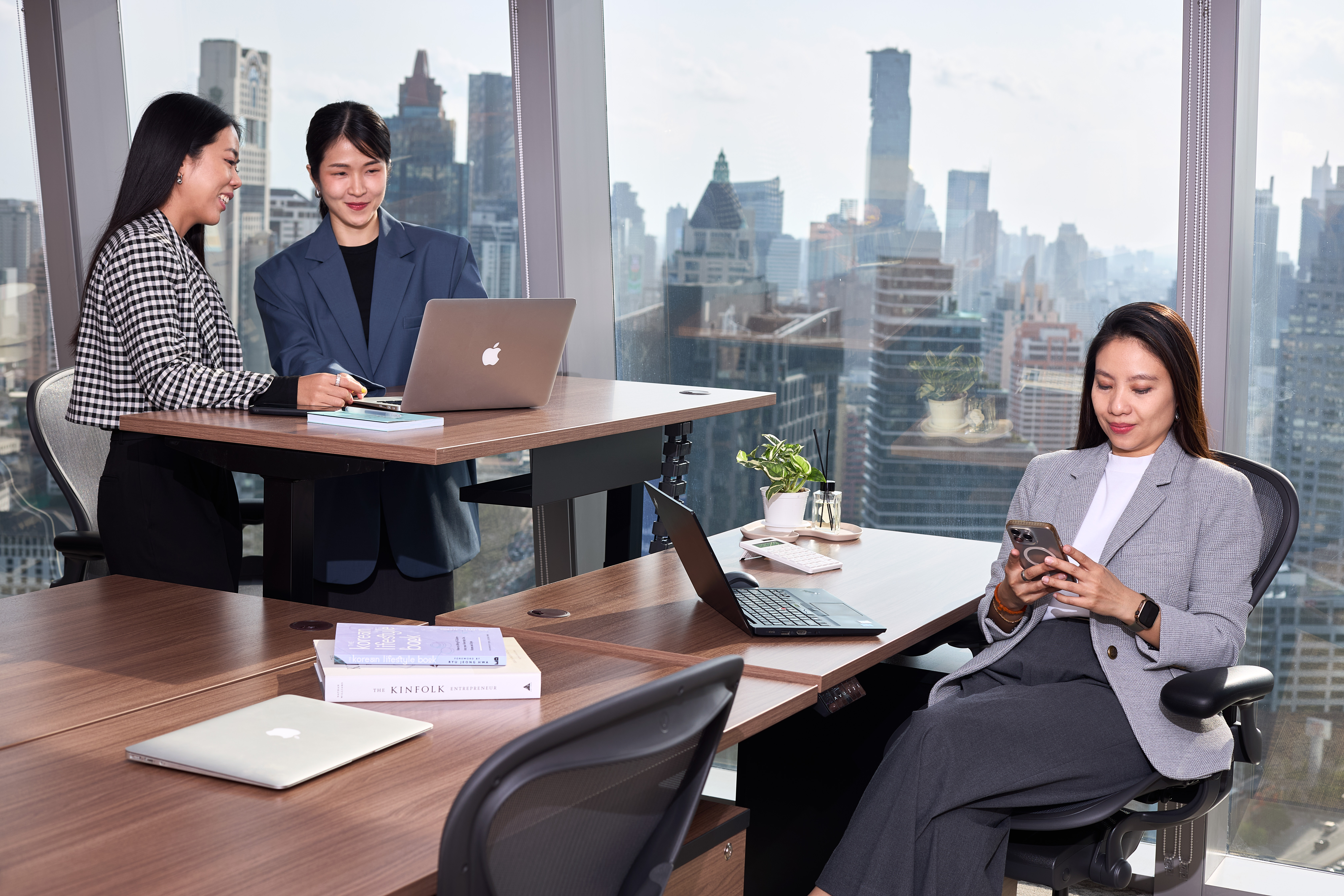 Business professionals working efficiently within Bangkok’s CBD area.